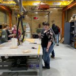 Picture of students working at a table in the Innovation and Collaboration Studio