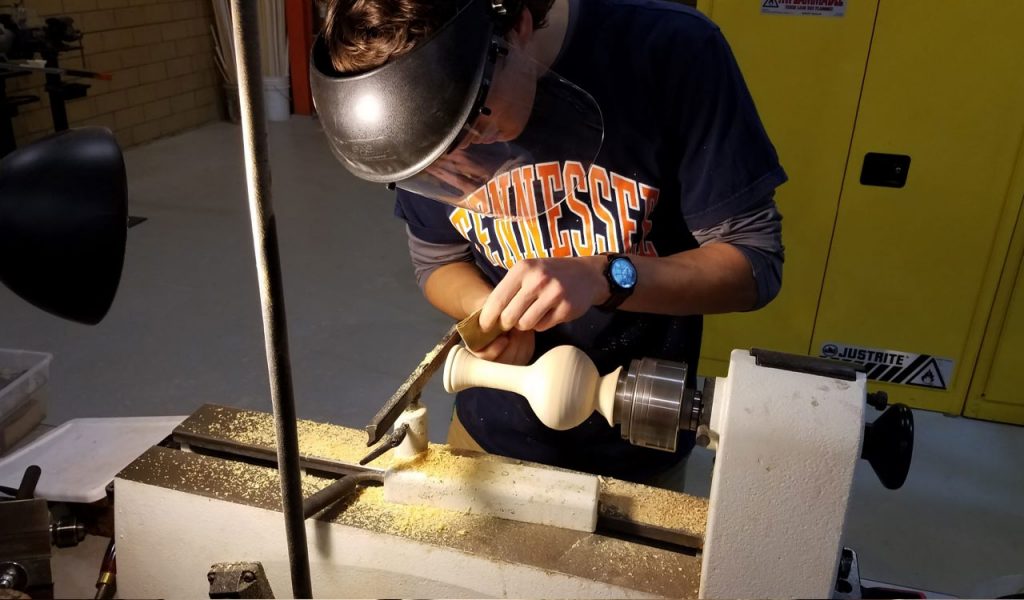 Student works on wood lathe in ICS Lab