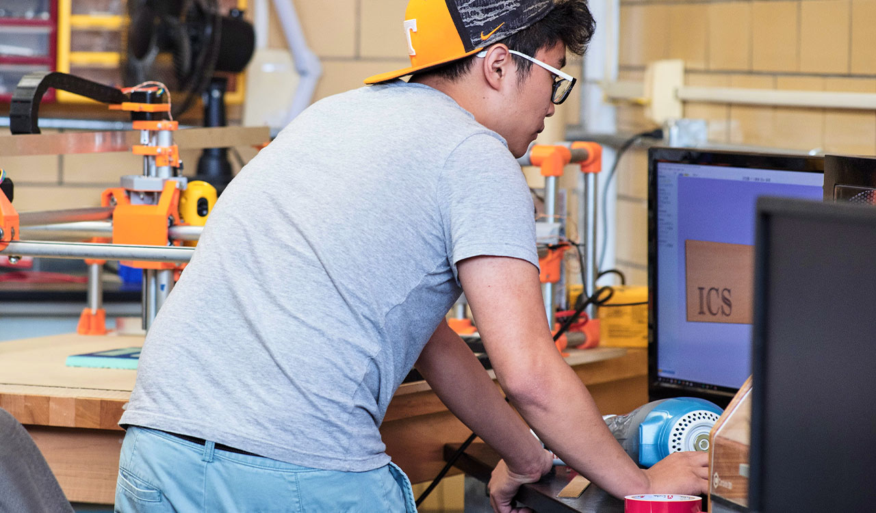 Student works with software for laser cutter