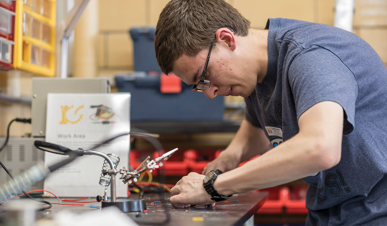 Student using soldering station